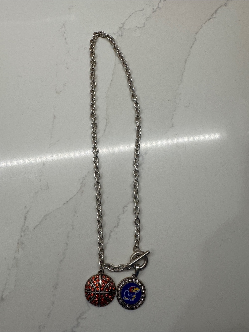 Silver-Tone Necklace with Red Basketball Charm and Blue Team Medallion